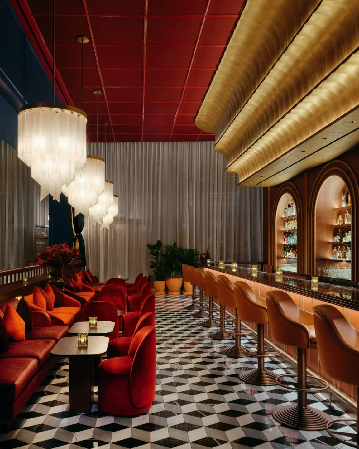 Interior of Carbone restaurant in New York City with stylish seating and bar.