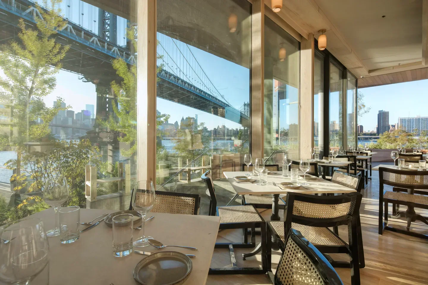 Celestine in New York City with Manhattan Bridge view, restaurant dining setting