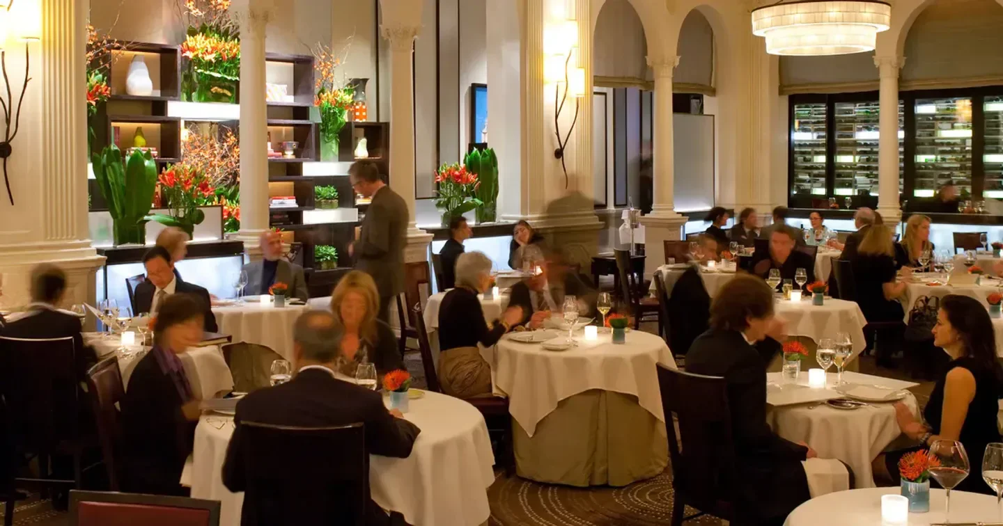 Elegant interior of Daniel restaurant in New York City with guests dining.