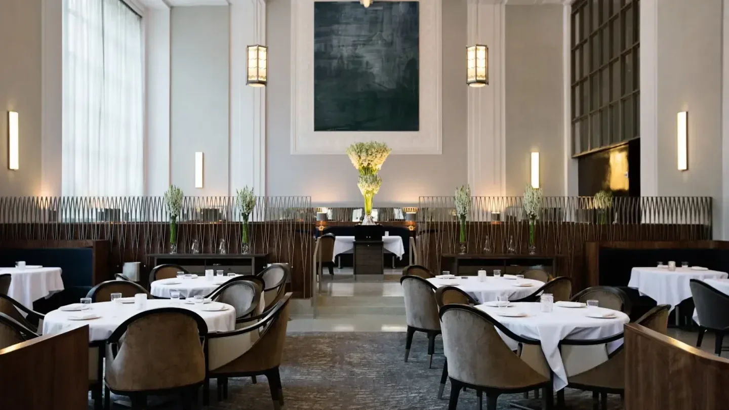 Elegant dining room interior at Eleven Madison Park restaurant in New York City.