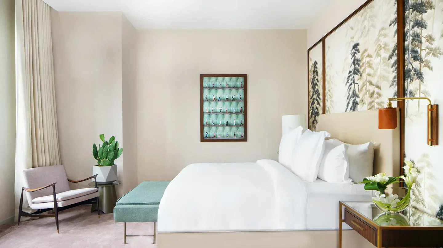 Cozy bedroom at the Four Seasons Hotel New York Downtown, featuring modern design in NYC.
