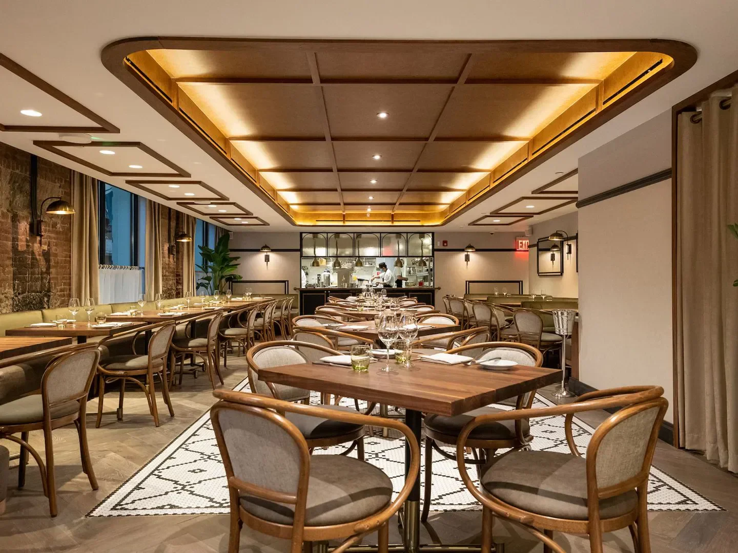 Interior dining space at Francie restaurant in New York City with tables set.