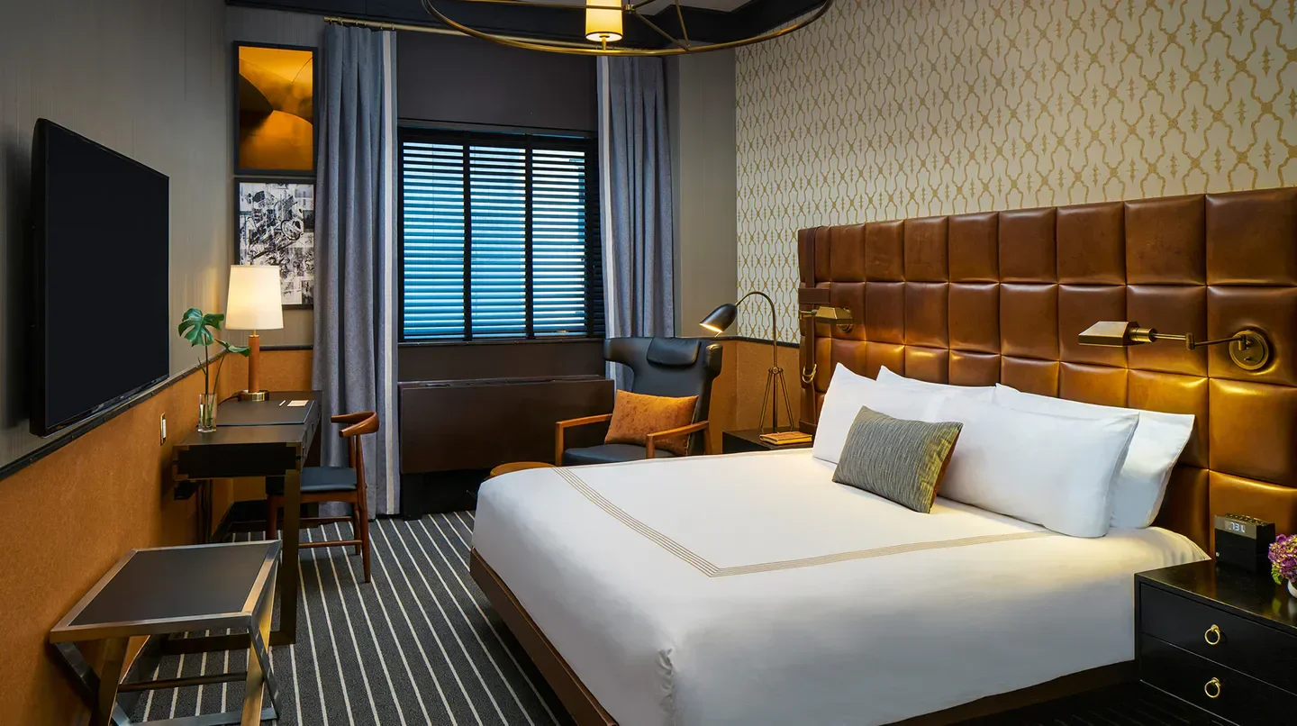 Cozy bedroom interior at Gild Hall, A Thompson Hotel in New York City.