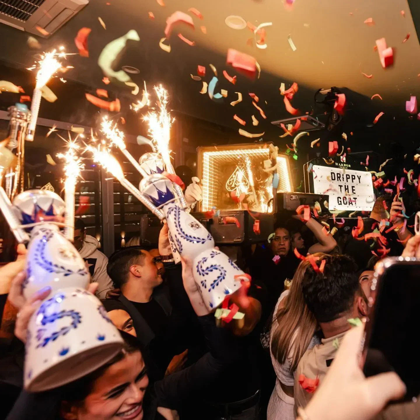 Confetti and sparklers at Harbor Rooftop Club in New York City nightclub celebration.