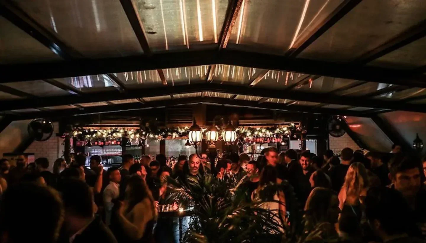 Nightclub scene at Hotel Chantelle in New York City with a crowd of people.