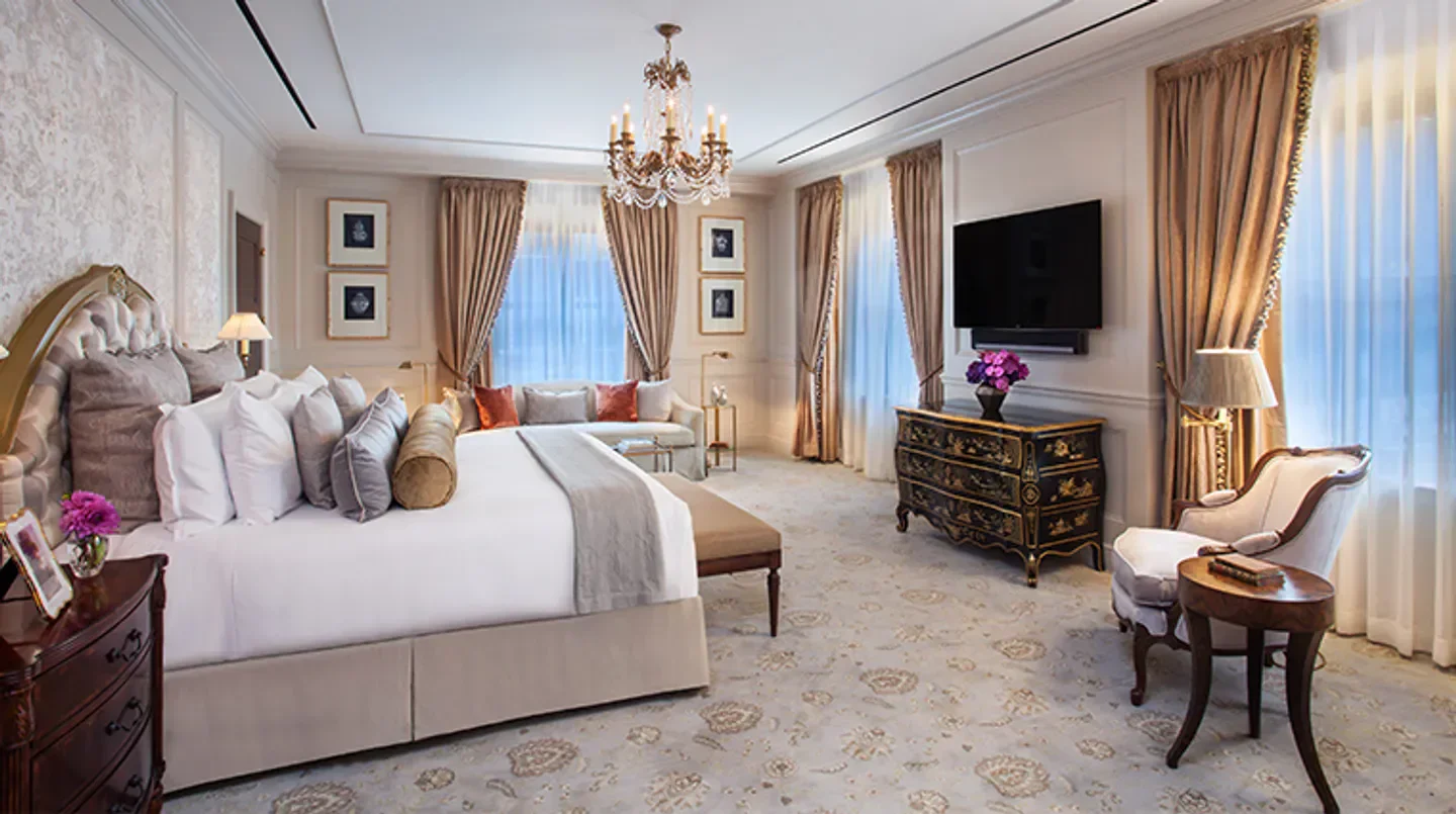 Luxury bedroom at InterContinental New York Barclay in New York City with elegant decor.