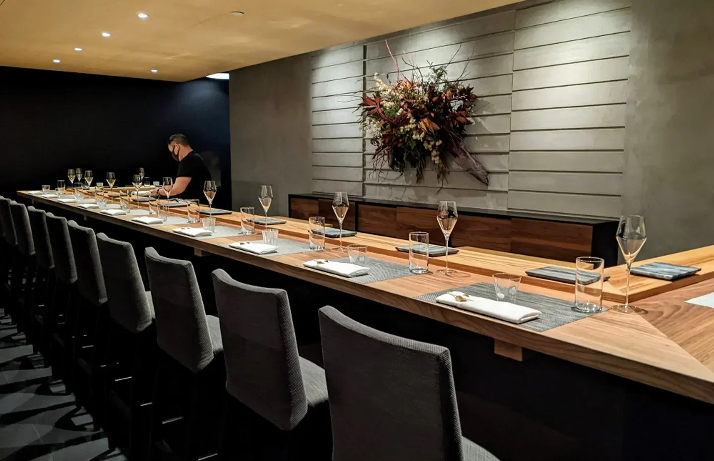 Elegant dining space at ITO restaurant in New York City with floral arrangement