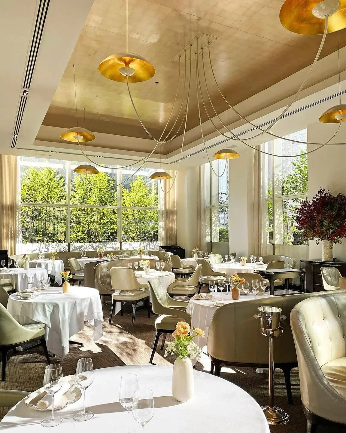 Elegant dining room interior at Jean-Georges in New York City with stylish lighting.