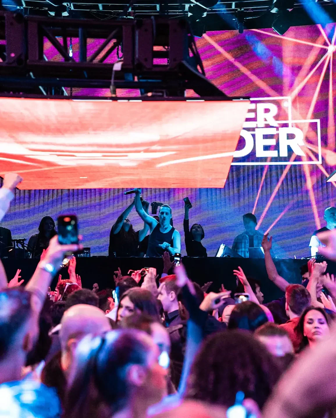 Energetic crowd at Nebula nightclub in New York City enjoying a live music performance.