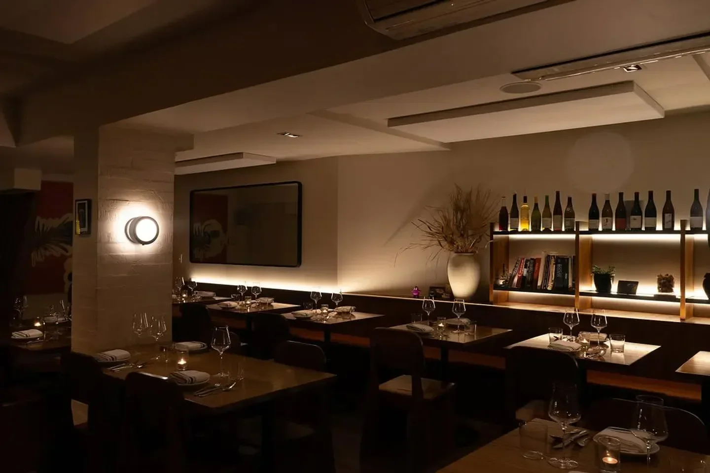 Cozy dining area inside Nudibranch restaurant in New York City with soft lighting