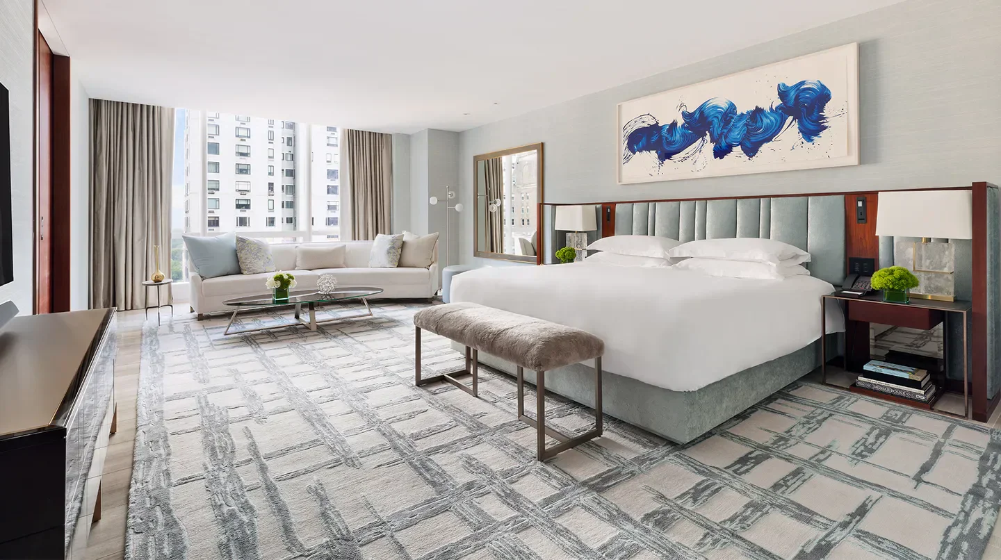 Spacious bedroom at Park Hyatt New York with city views in New York City.