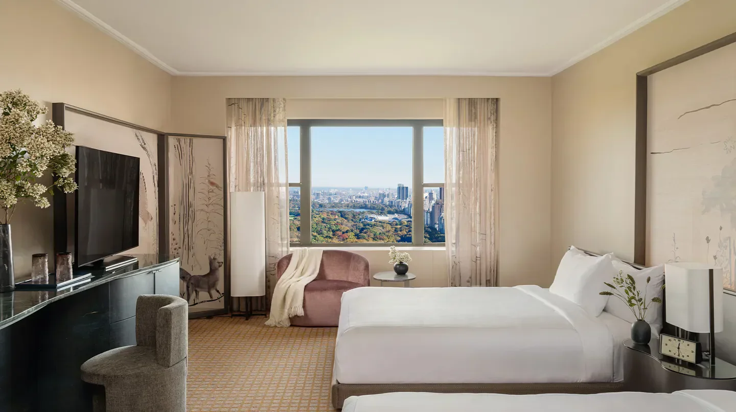 Park Lane New York hotel room with Central Park view, New York City skyline.