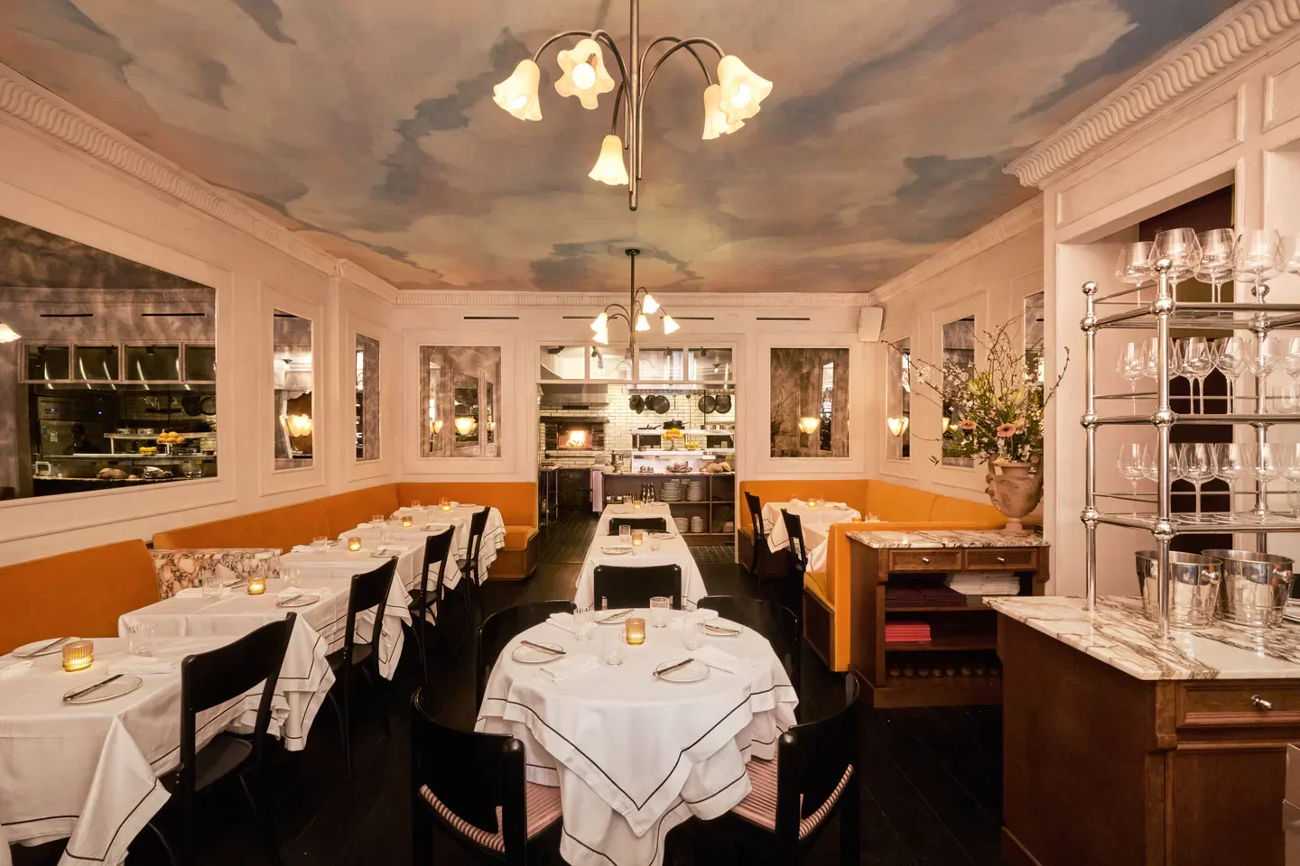 Interior of Raf’s restaurant in New York City with a whimsical painted sky ceiling.