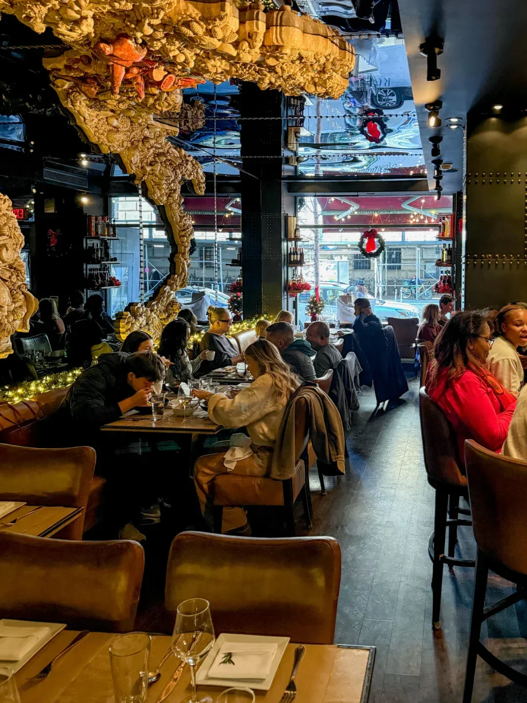 Dining room at Salumeria Rosi, a New York City restaurant with unique art and ambiance.