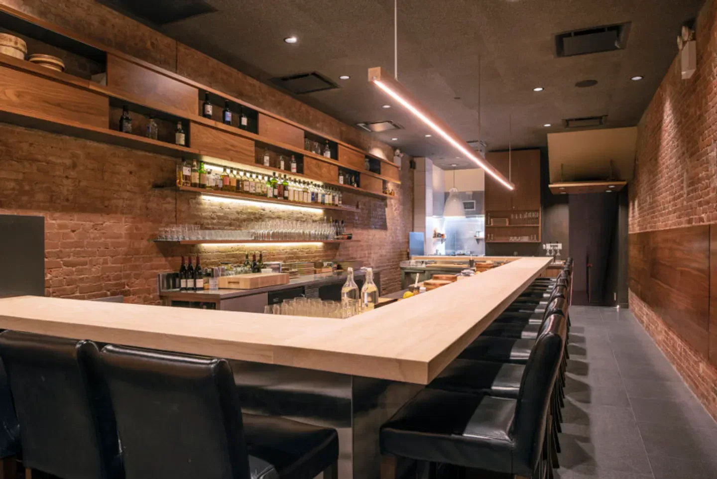 Interior view of Shuko restaurant in New York City with bar and seating area.
