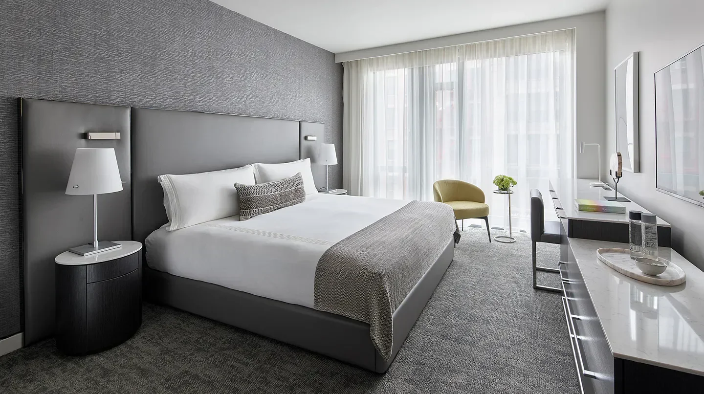 Stylish hotel bedroom at Smyth Tribeca in New York City with contemporary design.