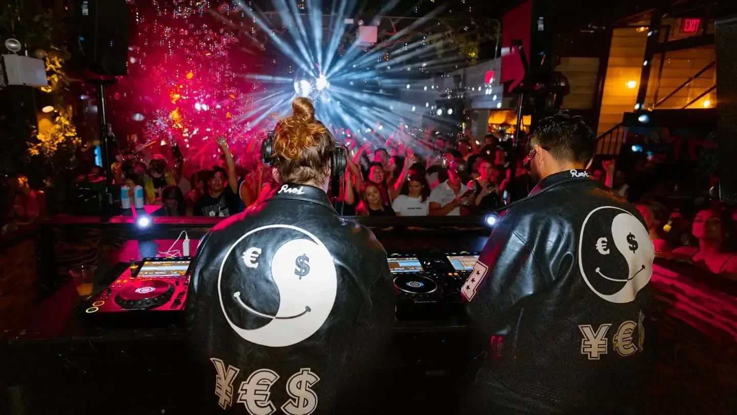 Energetic nightclub scene at Superior Ingredients in New York City with DJs and crowd