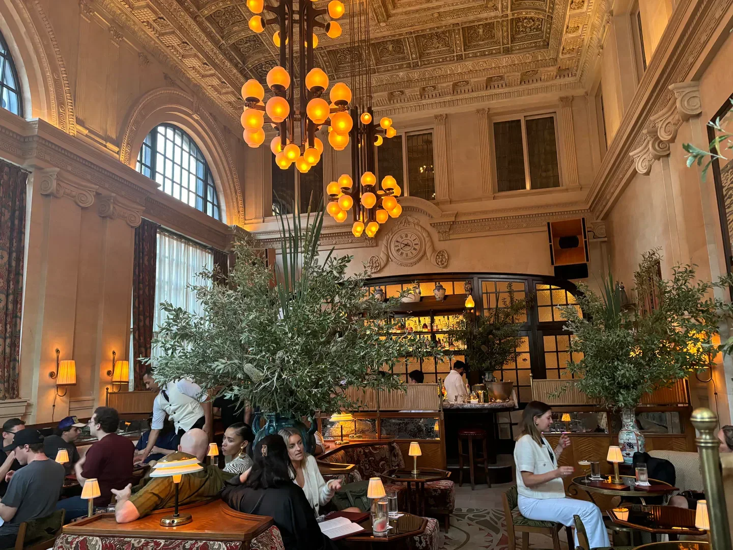 Interior of the Swan Room restaurant in New York City with ambient lighting and patrons.