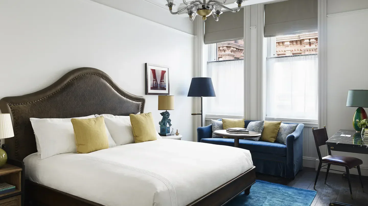 Cozy bedroom at The Beekman, A Thompson Hotel in New York City, featuring a plush bed
