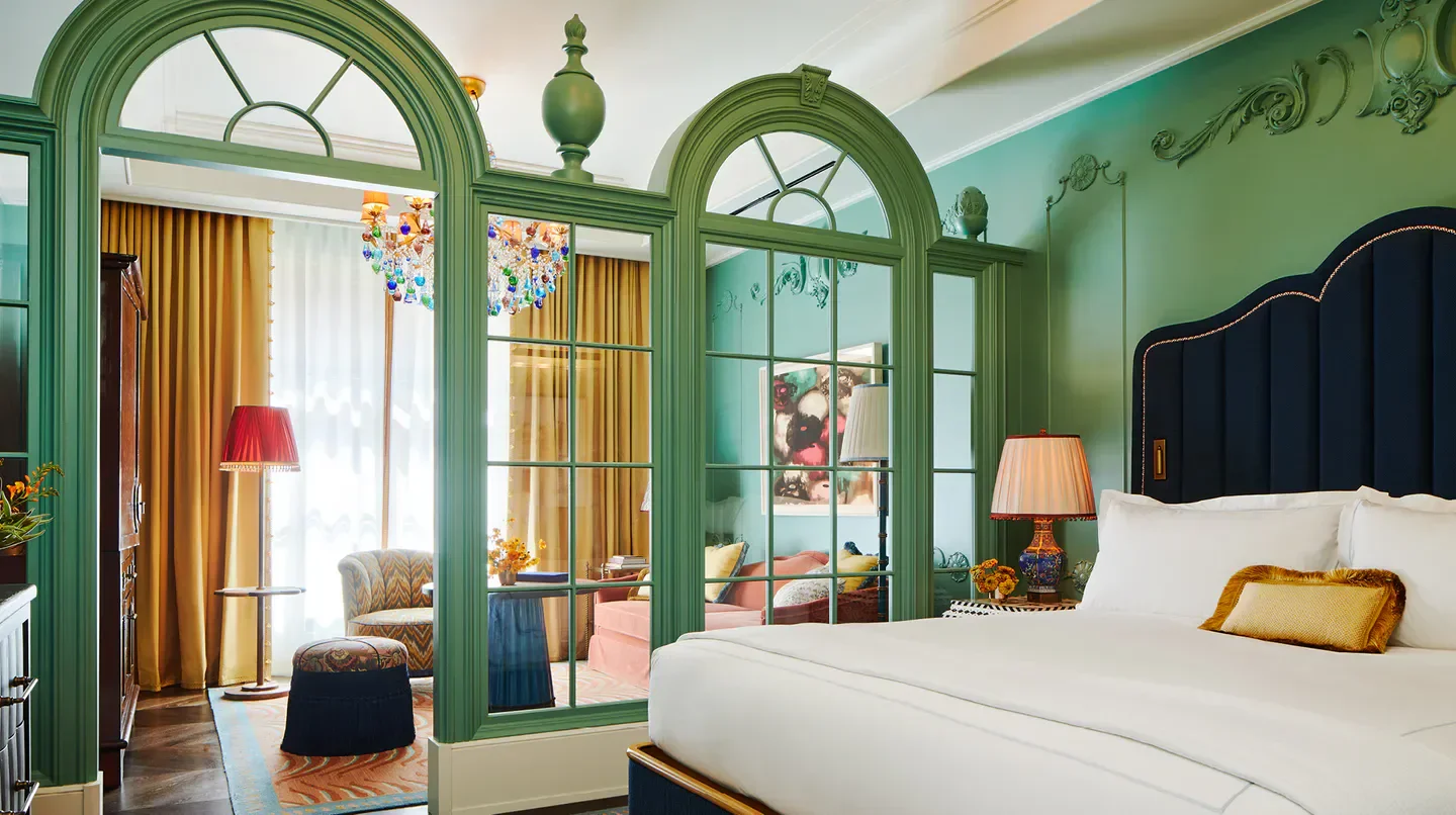 Elegant bedroom at The Fifth Avenue Hotel in New York City with luxurious design.