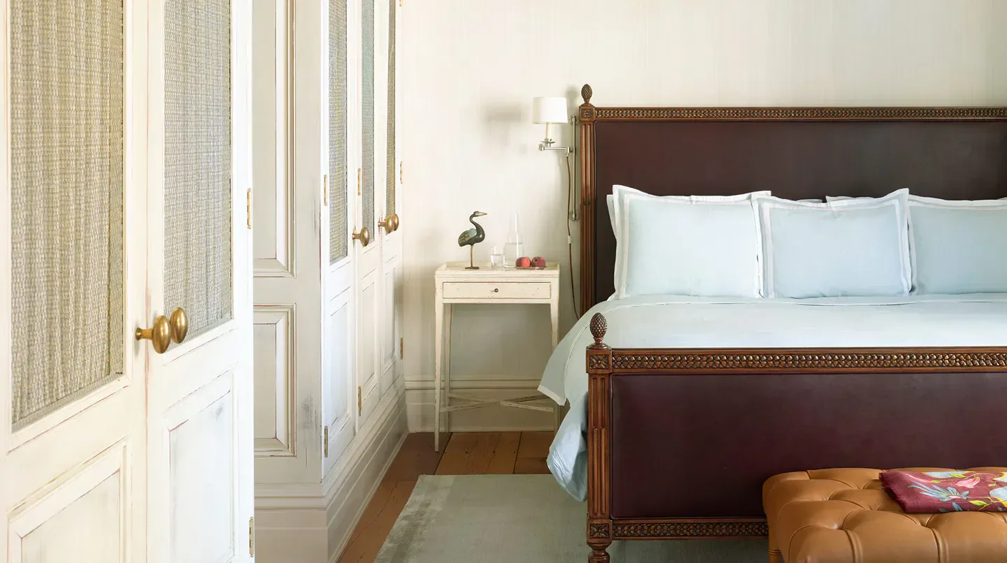 Elegant bedroom at The Greenwich Hotel in New York City with stylish decor.