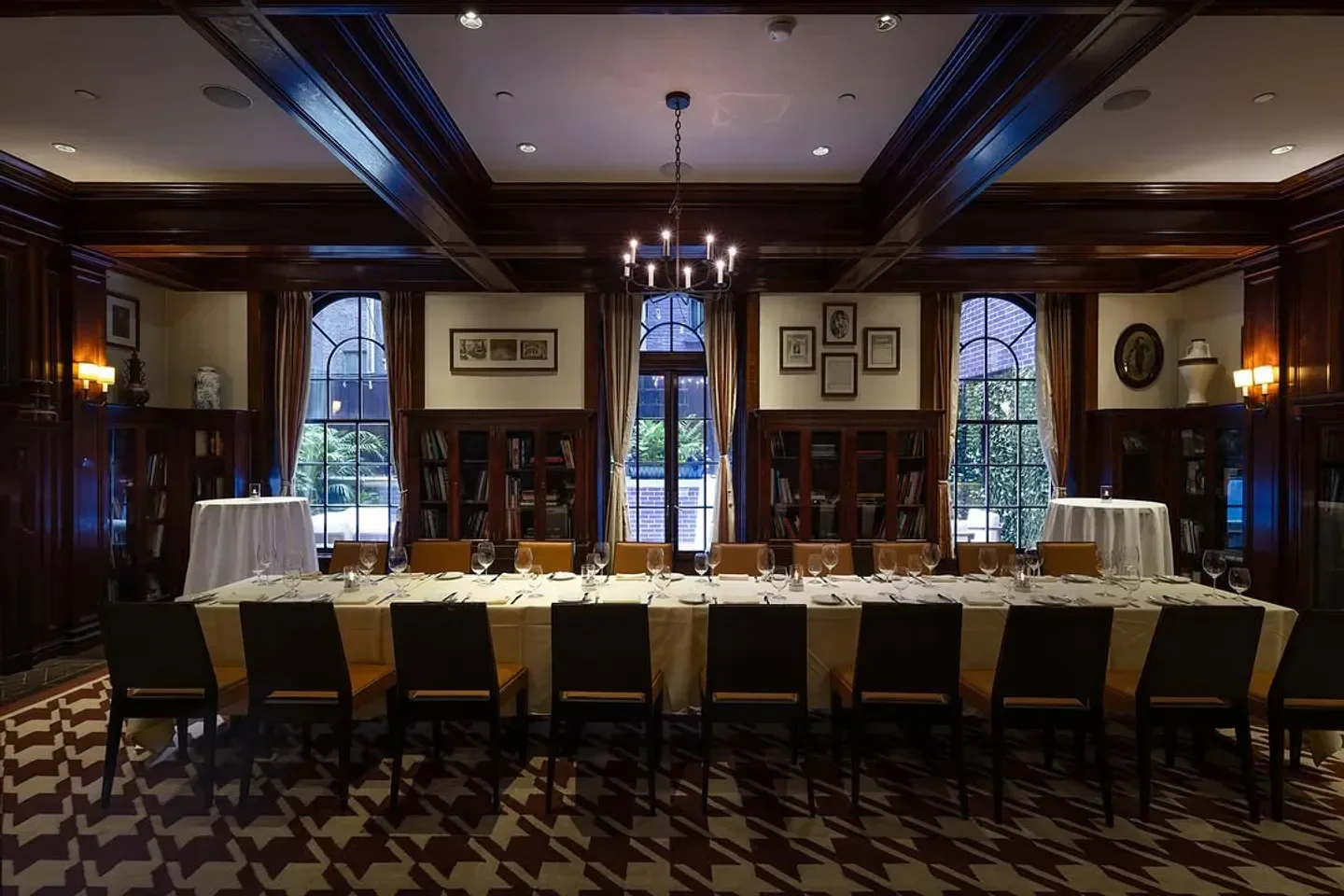 Elegant dining room at The Lambs Club in New York City with long table set