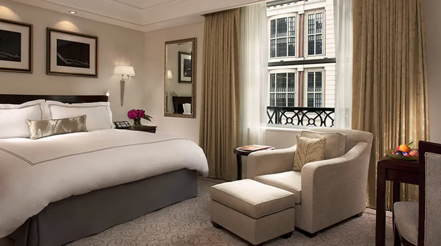 Cozy bedroom at The Peninsula New York, a luxury hotel in New York City.