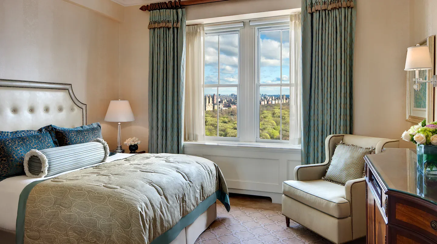 Bedroom view at The Pierre, A Taj Hotel, New York, overlooking Central Park in New York City.
