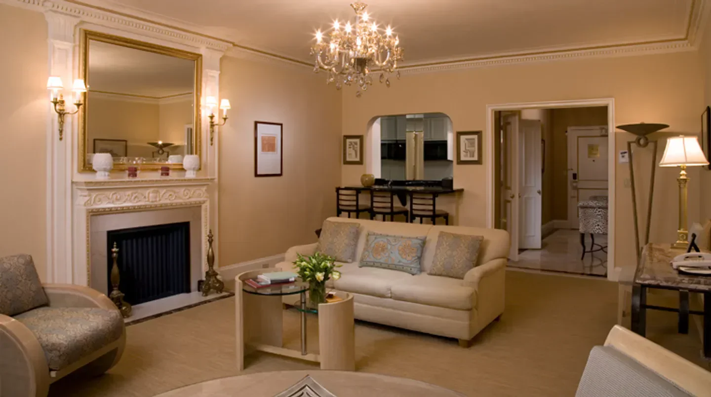 Elegant living area at The Sherry-Netherland hotel in New York City with fireplace.