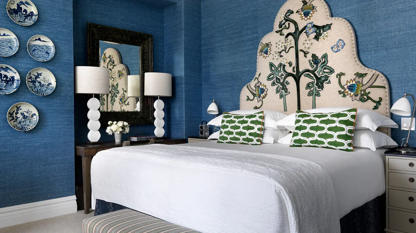 Cozy bedroom at The Whitby Hotel in New York City, featuring stylish decor.